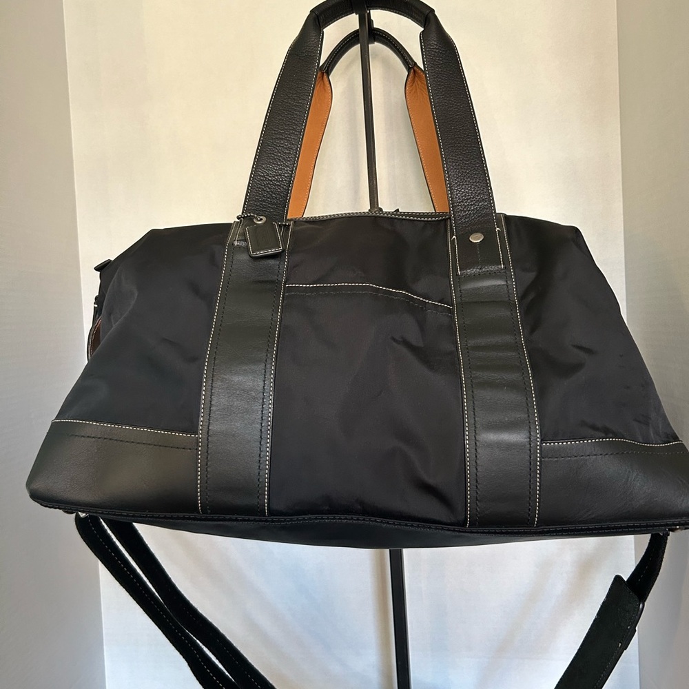 Leather &  Nylon w/removable shoulder strap. Gently used,from smoke free home.